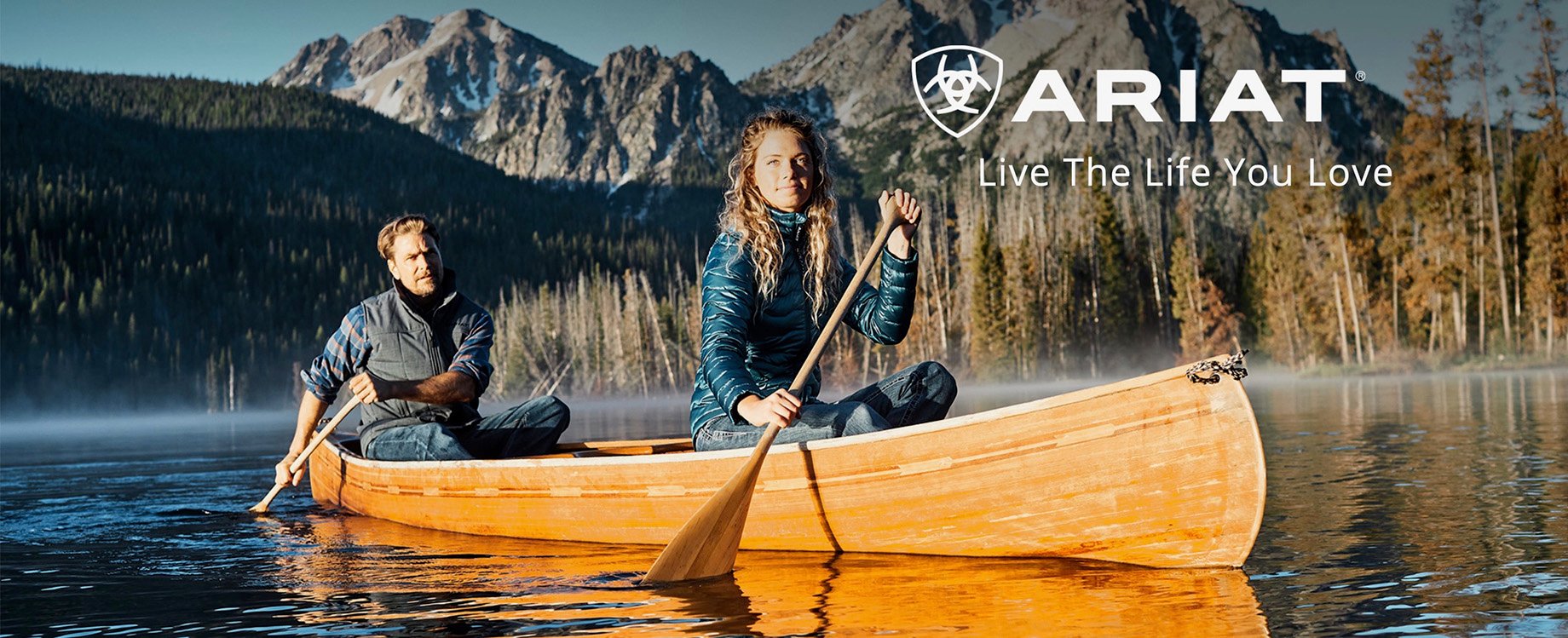 Tear sheet of two people canoeing on a foggy lake shot by Hillary Maybery for Ariat