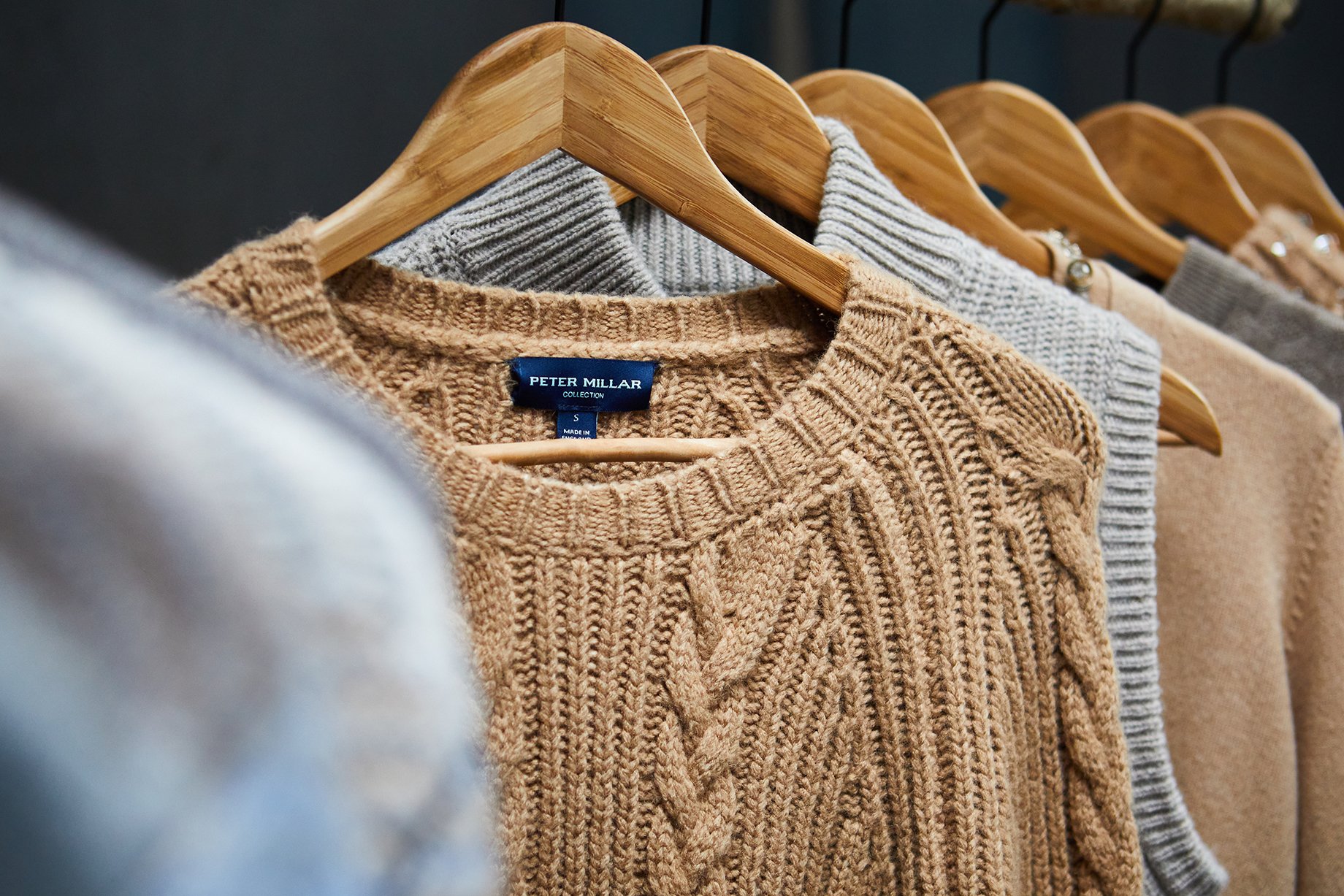 Peter Millar sweaters on a rack shot by Jackson Ray Petty 