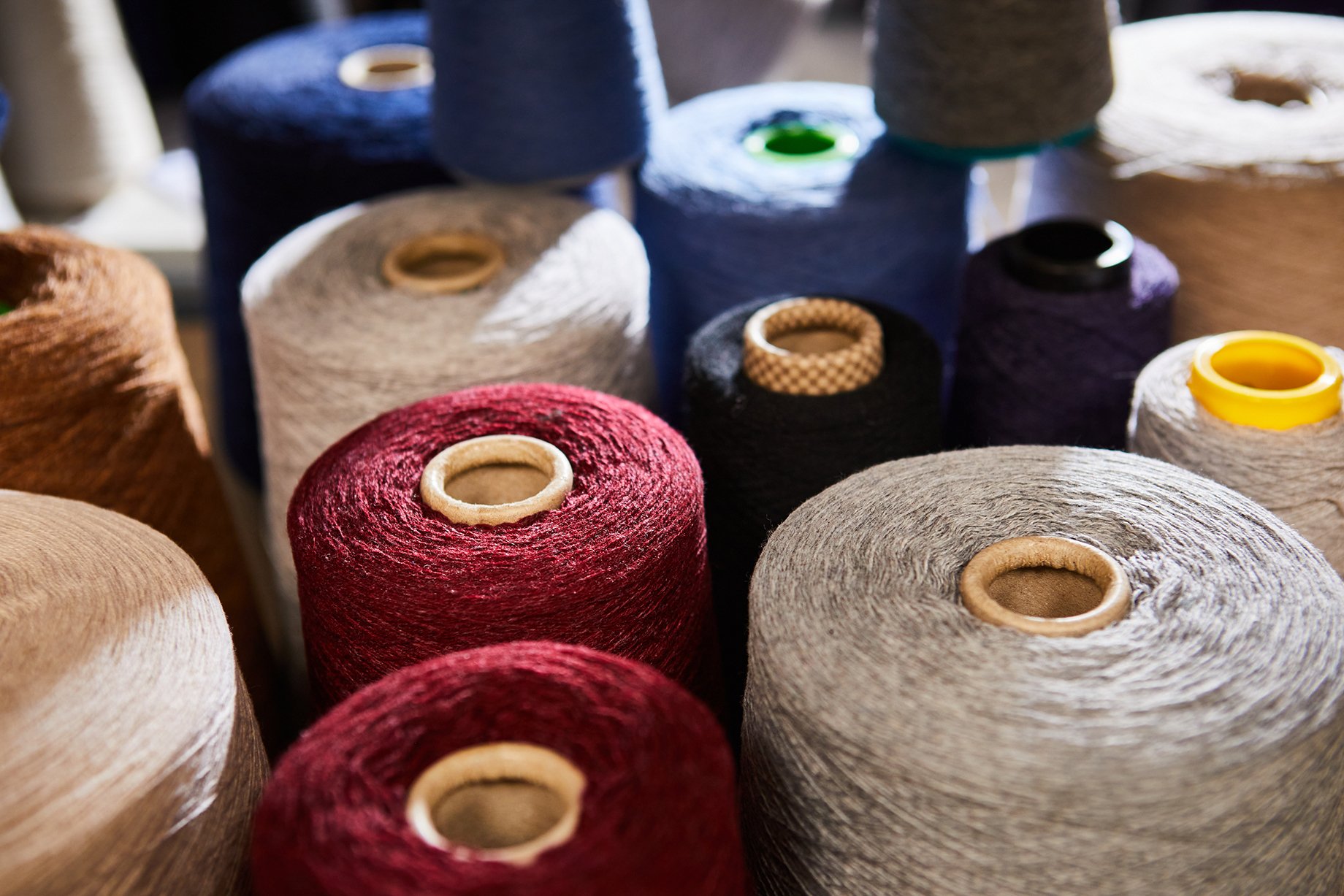 Fiber spools at Albion Knitting Co. shot by Jackson Ray Petty for Peter Millar