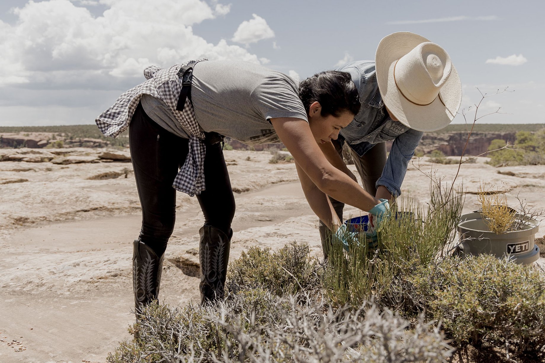 Missy Begay and Shyla Sheppard forage for ingredients in Canyon De Chelly shot by Minesh Bacarina for Outside Magazine