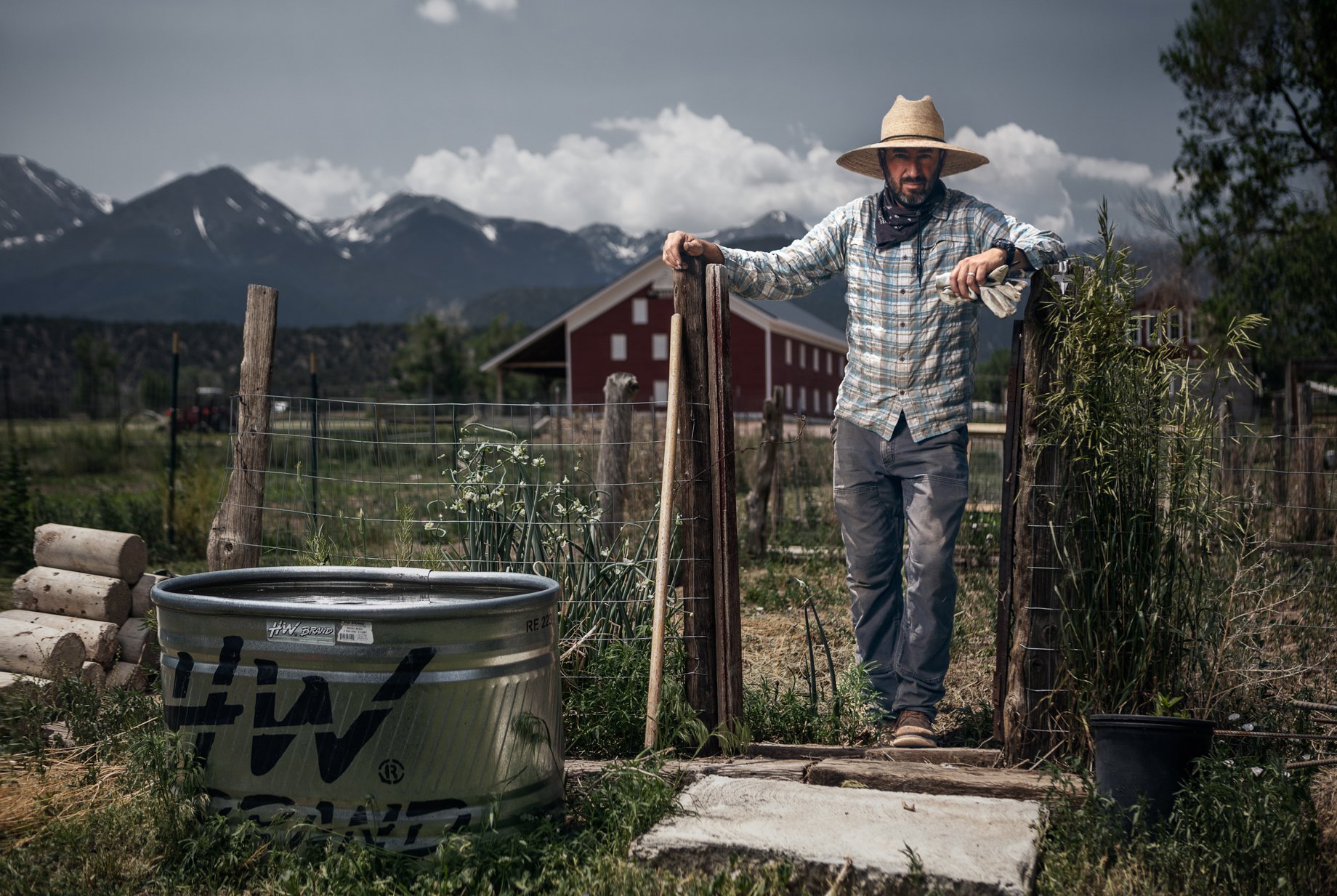 Farmer in front of fences on Howard Creek Farm shot by Doug Gritzmacher