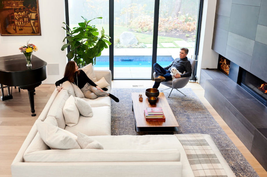 The Molina family sitting in living room built by GSW Architects shot by Bill Purcell for the Wall Street Journal.