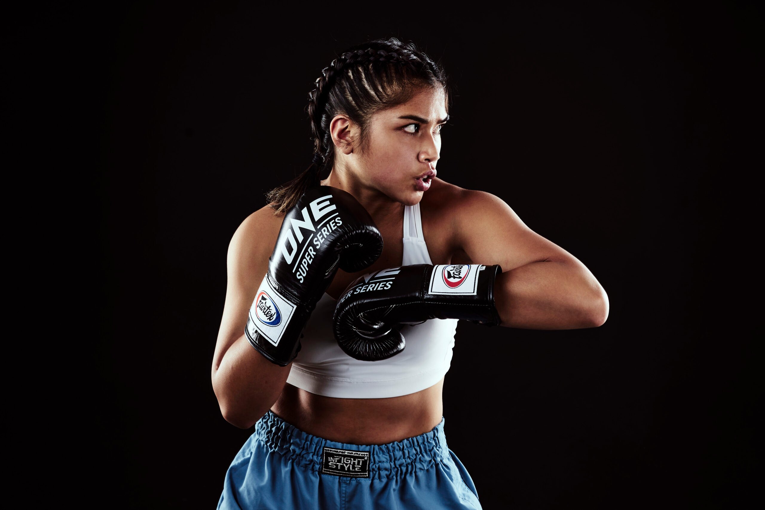 Jeff Dojillo's in-studio portrait of Jackie Buntan pulling out her moves in Infightsyle shorts and ONE Champrionship gloves