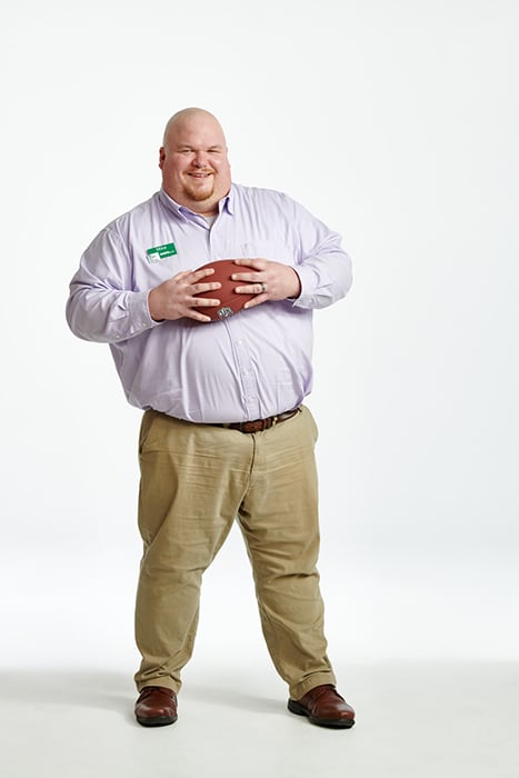 Michael Muller, a WSFS Banker holds a football to illustrate his love for the Birds. Photographed by Dave Moser. 