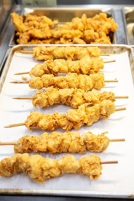 Chicken on a stick photographed by Karen Segrave for Coulson Oil. 