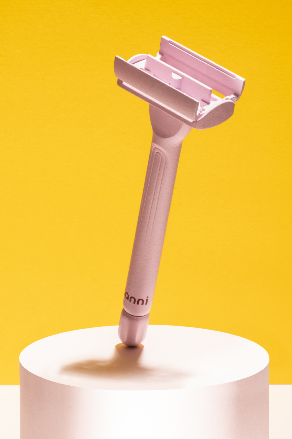Hanni razor on display with bright yellow background shot by Katelin Kinney