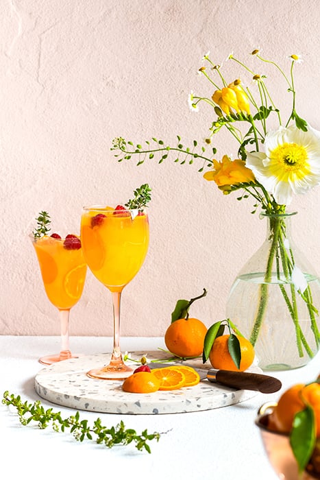A bright, bold drink shot featuring Clementine Skies. Photographed by Laura Chase de Formigny. 
