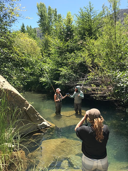 A behind the scenes look at Mikaela Hamilton photographing Topa Topa Brewing's Level Line can in a fly fishing scene. 