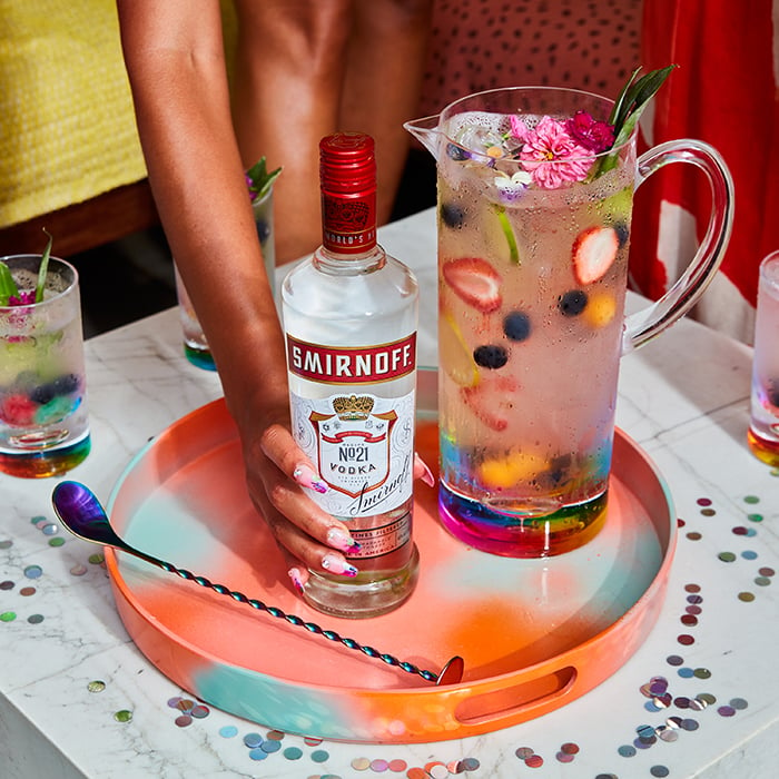 A colorful product shot with a Smirnoff bottle and cocktail pitcher. Photographed by Paul Quitoriano for Smirnoff.