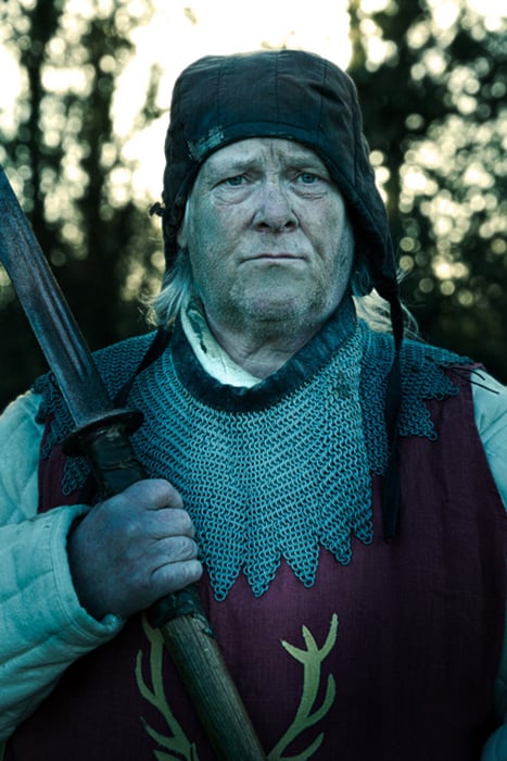A member of the Legion of the Stag holds a sword. Photographed by Simon Plant.