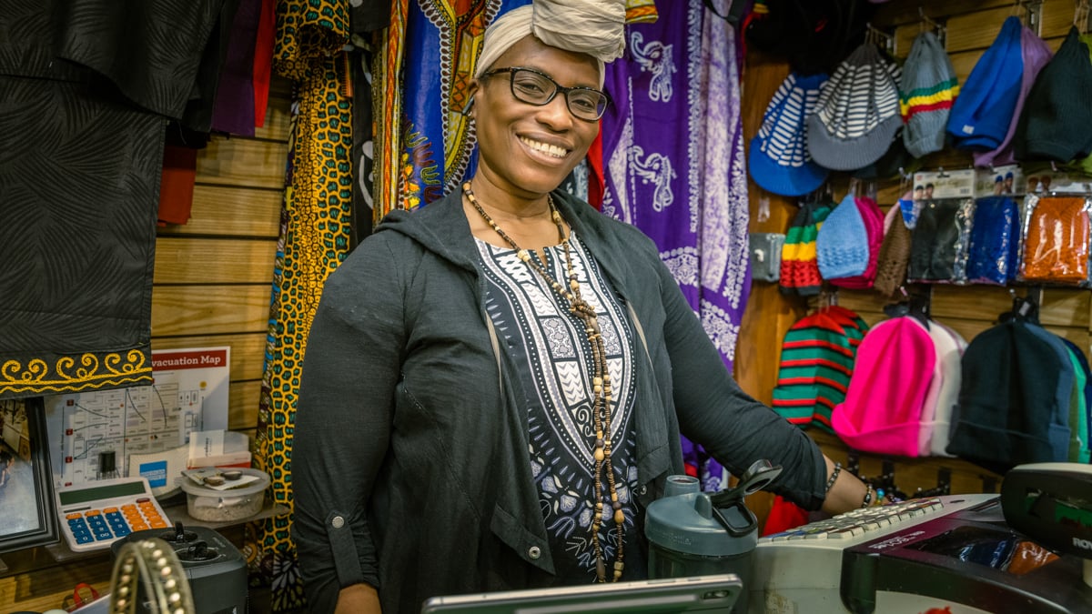 A photo of a woman in her store by Zave Smith.