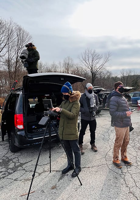 Drone operator, Emily Andrews, first assistant Nick Parisse, and Agency producer on set while capturing drone imagery of Con Edison's solar farm.