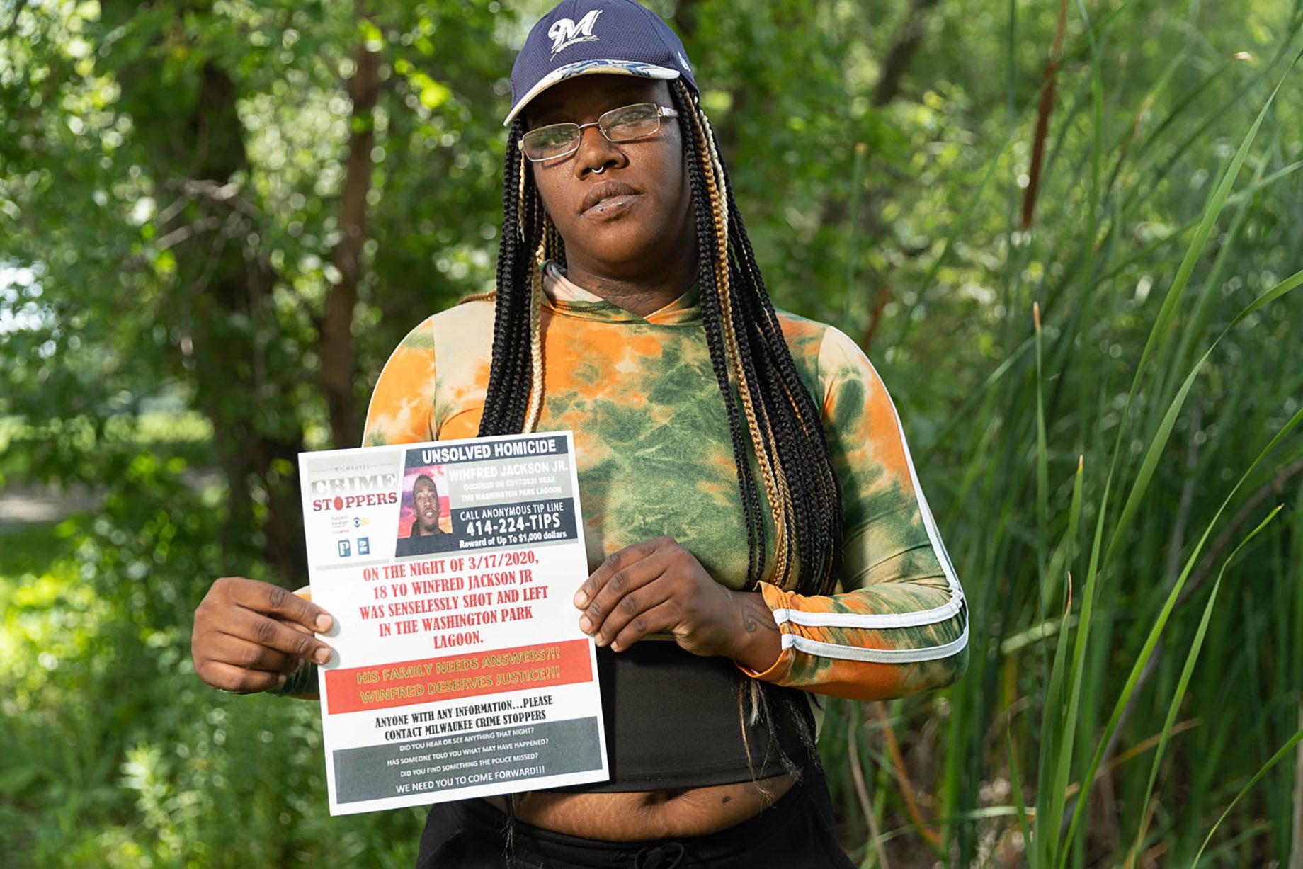 Jalisa Martin holding flyer for information shot by Sara Stathas for the LA Times