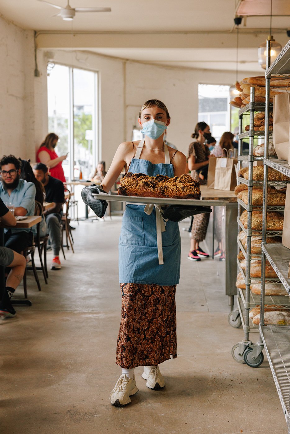 Woman working at Miami bakery shot by James Jackman for The New York Times