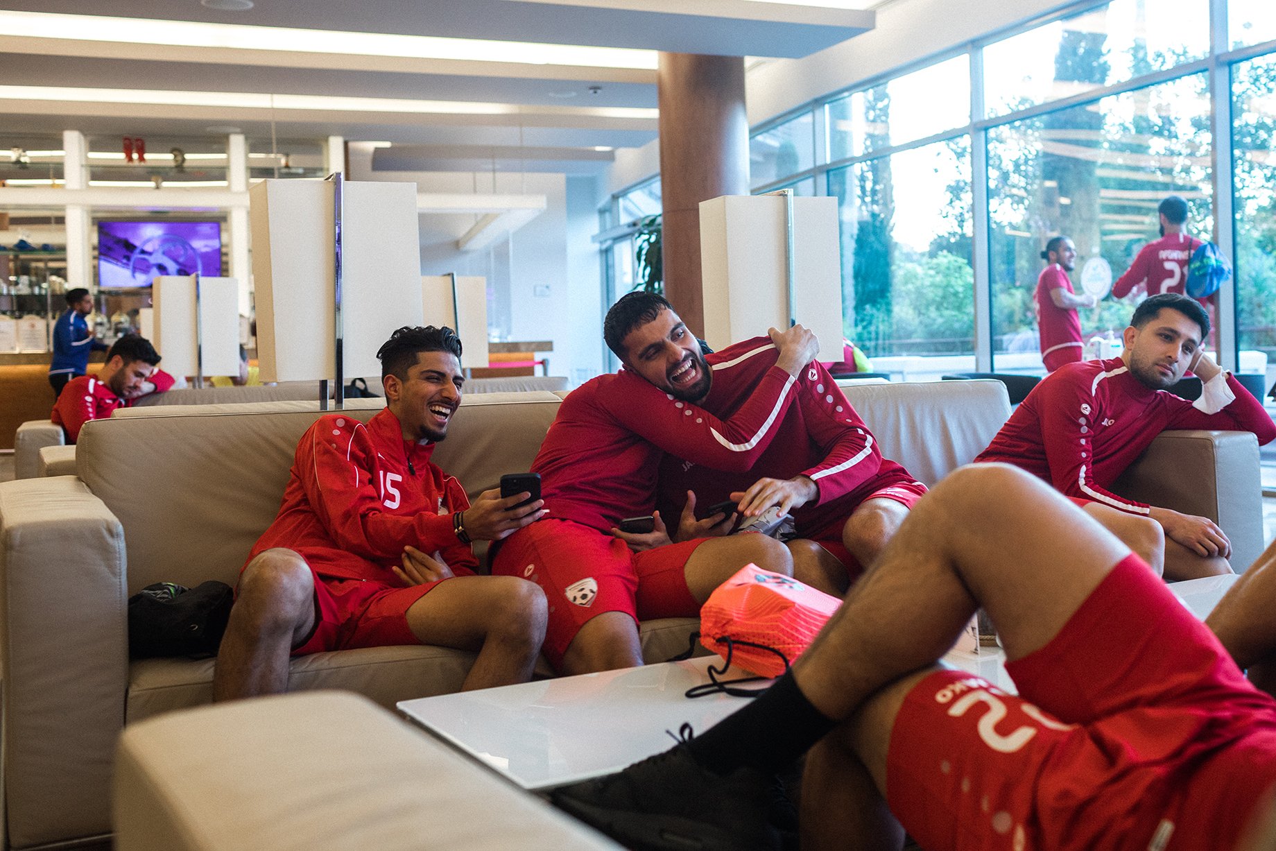 The Afghanistan National soccer team players rest and joke at the Gloria Sports Arena, Antalya, Turkey, before their international friendly match with Indonesia. Shot by Bradley Secker for the New York Times.