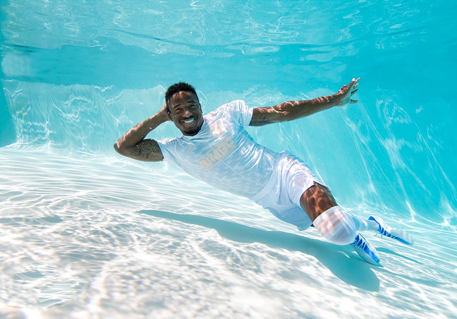Philadelphia Union soccer player Sergio Santos shows off his signature "Sergio" tattoo (seen on his right arm) while floating around in photographer Julia Lehman's pool.
