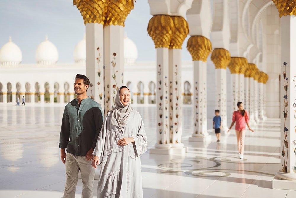 A family takes in the sights at a mosque in Abu Dhabi, images captured by photographer Tom Parker.