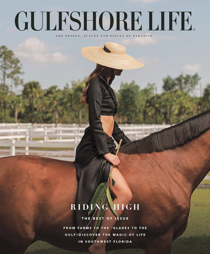 Cover shot tear sheet of chic rider on horseback, with sun hat and hiked black silk two-piece, leafed branch in hand, by Fort Myers, FL-based lifestyle photographer Brian Tietz.
