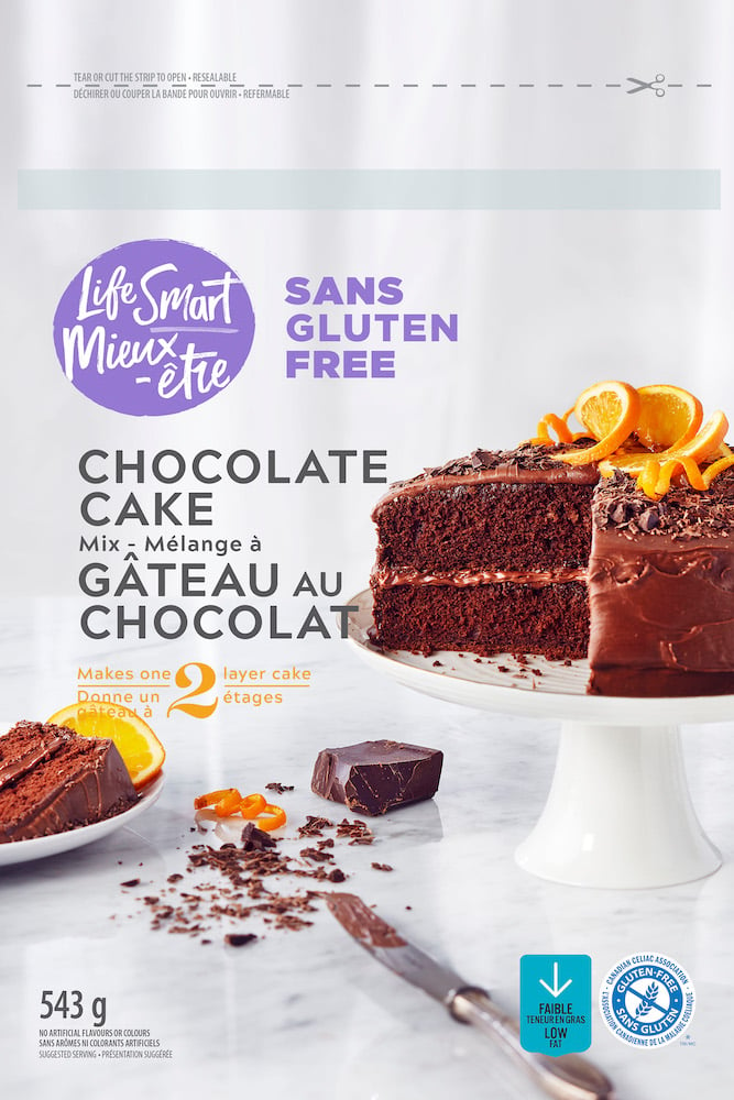 Packaging tear sheet of chocolate cake mix, presenting cake on cake stand garnished with orange slices and zest, by Montreal, Canada-based food/drink photographer David De Stefano.