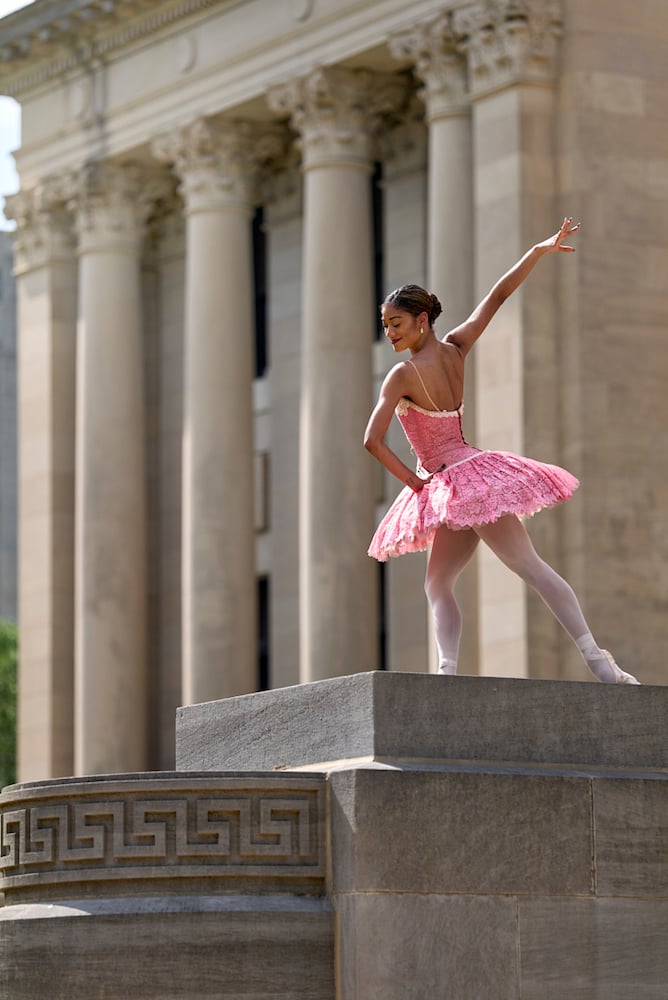 Photo of ballerina in pancake tutu, smiling in front of large building with corinthian columns, by Tuscaloosa, Alabama-based music/performing arts photographer Michael J. Moore.