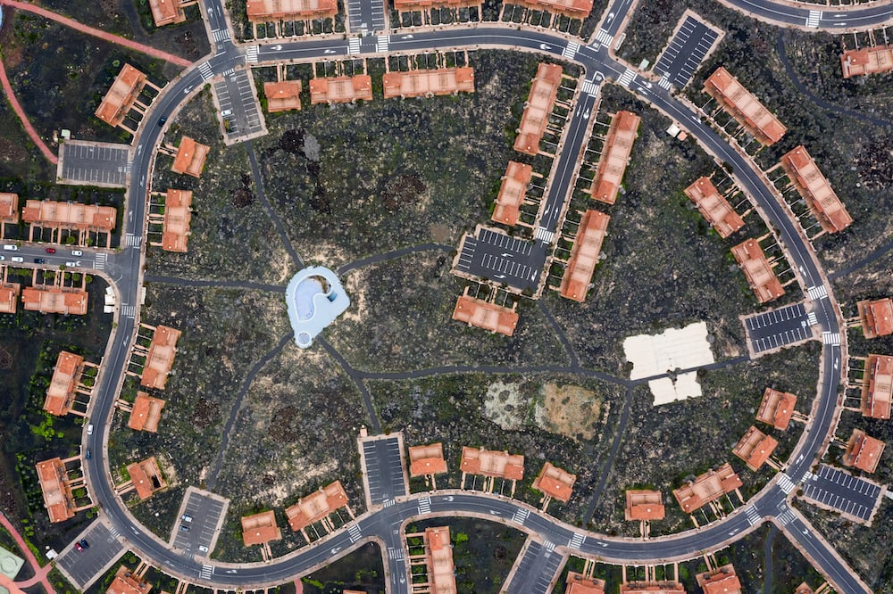Aerial view of abandoned housing development in ring formation, by Donostia-San Sebastian, Spain-based social documentary photographer Markel Redondo.