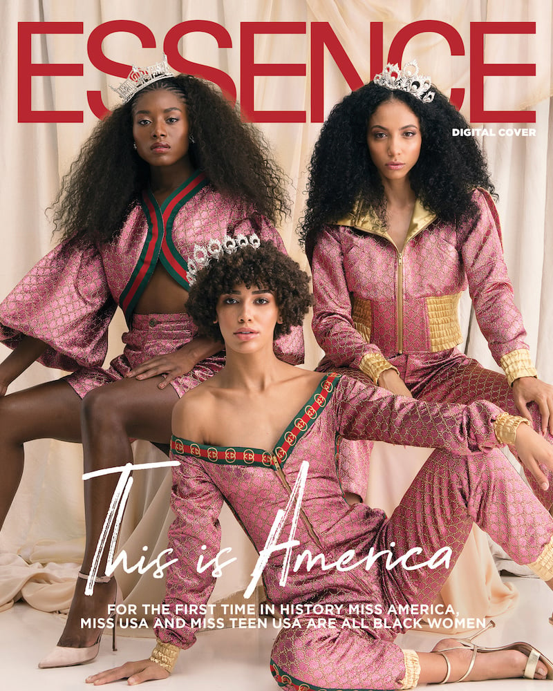 Magazine cover of three stylized beauty pageant winners in pink silk, seated, with natural curly hair and offset tiaras. 