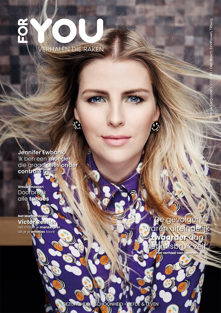Cover portrait of blonde musician in purple blouse with white polkadots, figure's hair being stylistically blown from the front, by Tilburg-based photographer René van der Hulst.