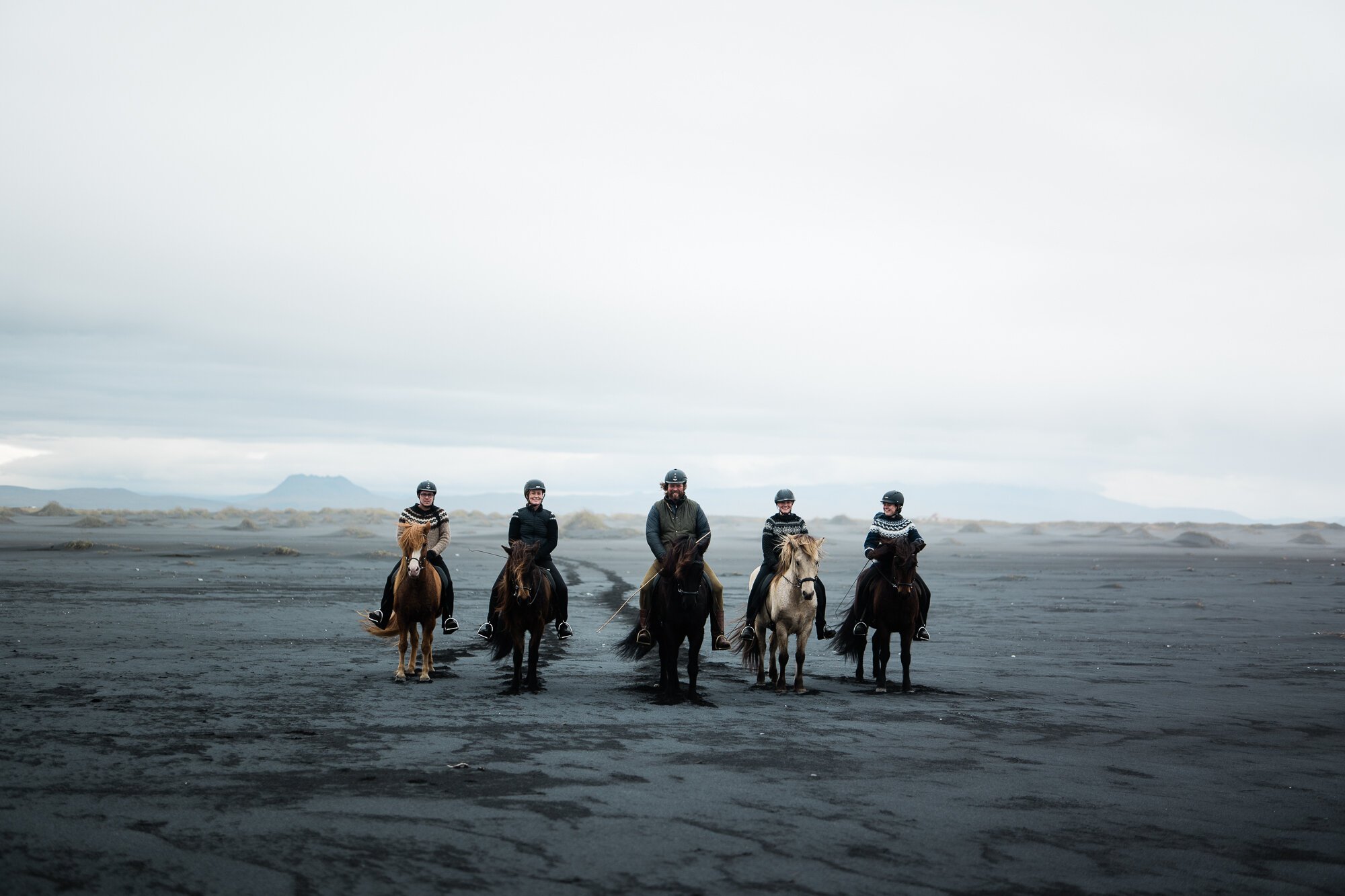 Abigail Bobo's image for Airbnb shows five people on horses in an open area