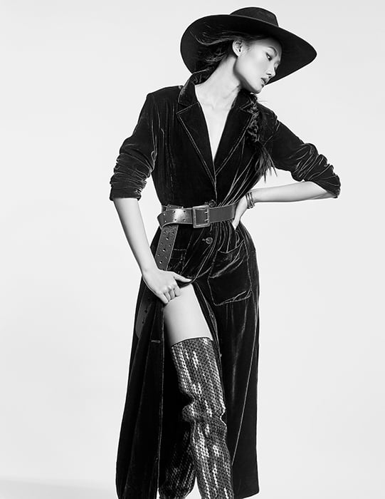 Photo by Adrianna Favero of a model in a velvet coat and wide-brimmed hat.