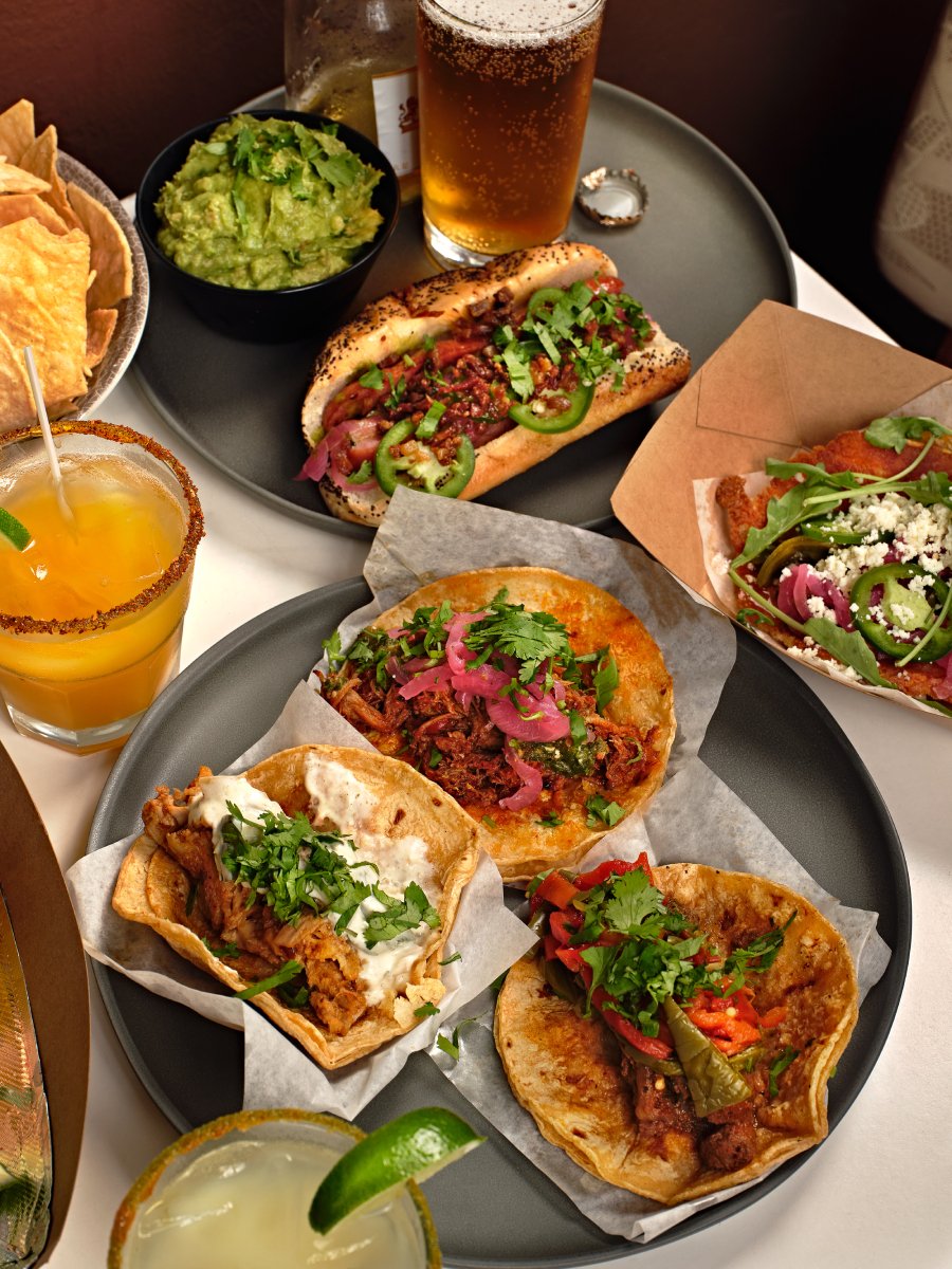 Photo by Chuk Nowak of plates of sandwiches and tacos.