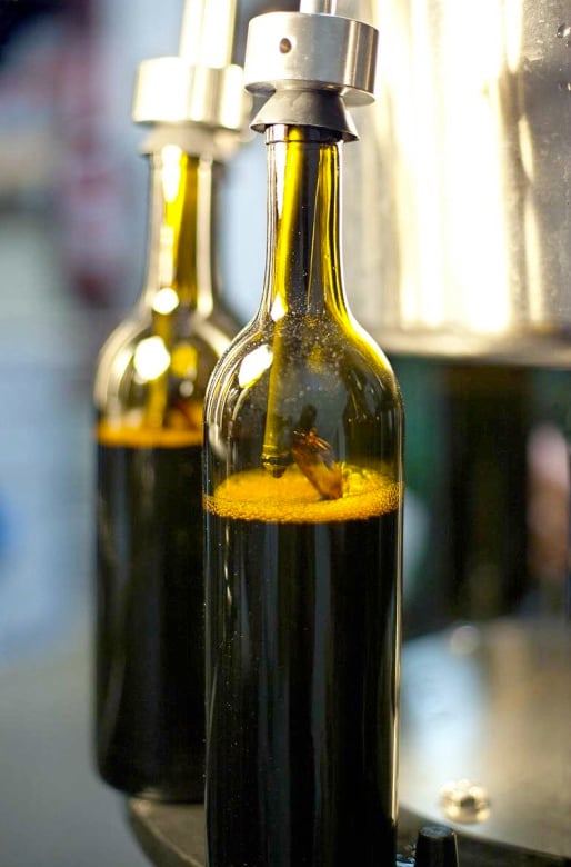 Bottling wine at a Washington vineyard shot by Seattle-based portrait photographer Ron Wurzer