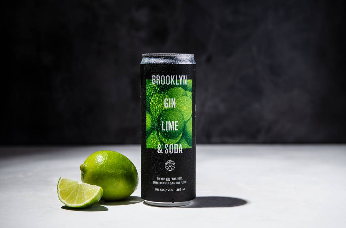 Photo of a canned cocktail against a black background.
