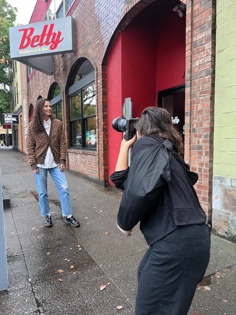 Photographer Inti St. Clair photographing Sue Bird outside of her favorite restaurant Betty.