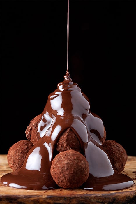 Dripping chocolate on chocolate balls by Miami food photographer Marcel Boldú