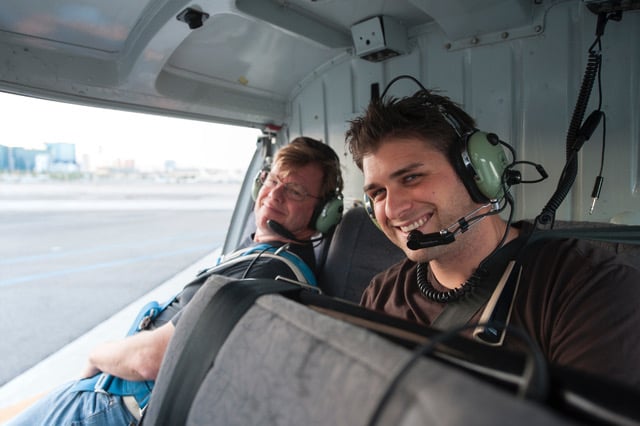 Photographer Joe McNally and assistant Drew Gurian in helicopter for aerial photoshoot