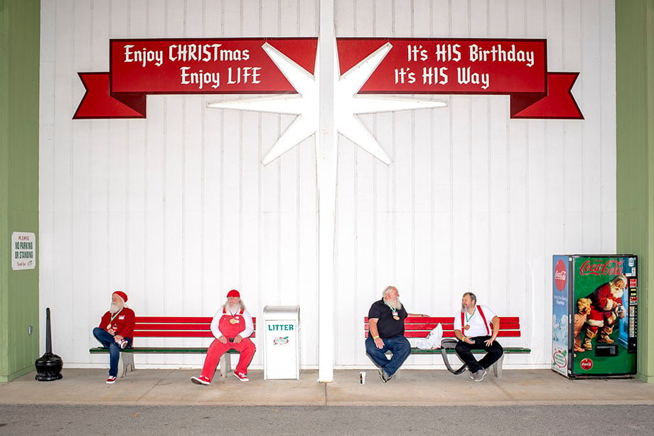 Santas relax outside of Bronner's Christmas Wonderland during the 84th annual Charles W. Howard Santa Claus School