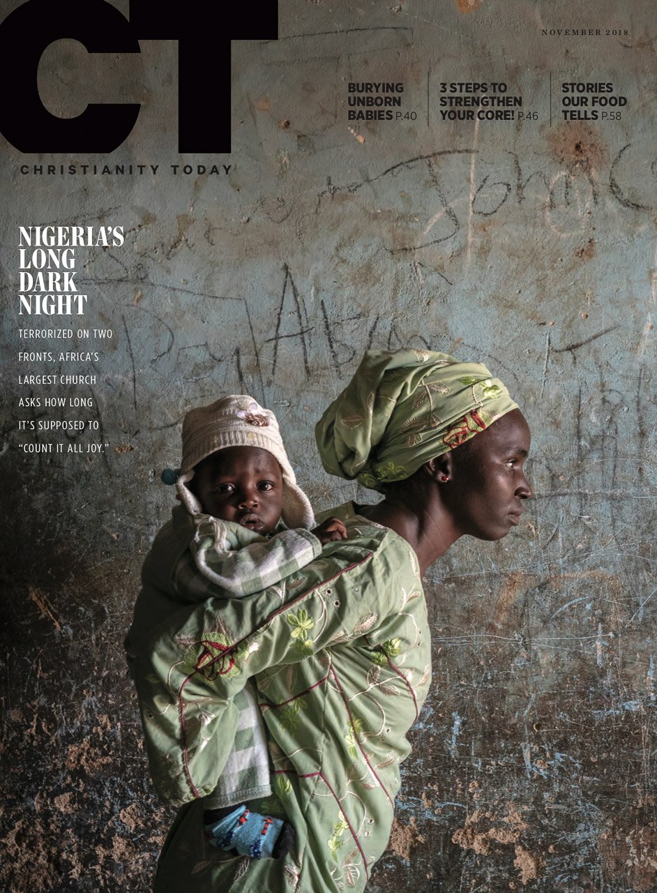 The cover image of Christianity Today, featuring a Nigerian mother holding her baby on her back, shot by Atlanta-based humanitarian photographer Gary S. Chapman. 
