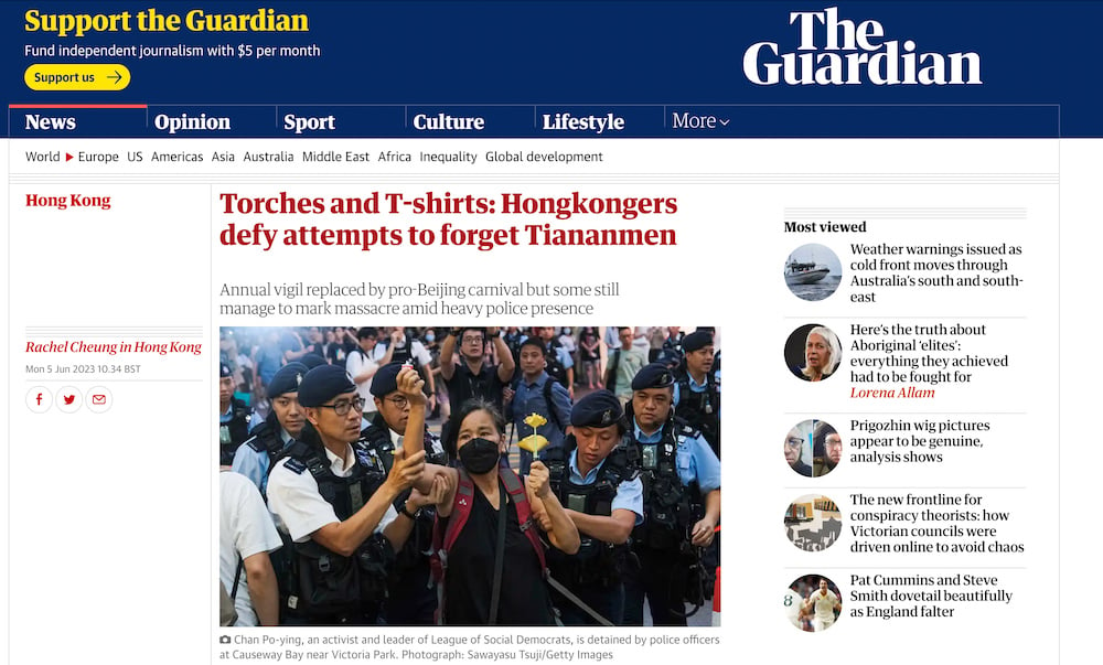 Tear sheet of masked protestor being restrained by Hong Kong police, by Hong Kong-based breaking news photographer Keith Tsuji. 