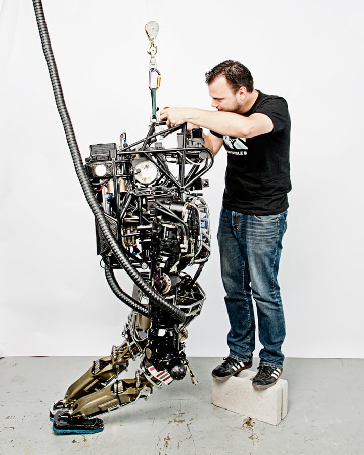 Image of a man working on a robot by Watertown, Massachusetts-based photographer Webb Chappell. 
