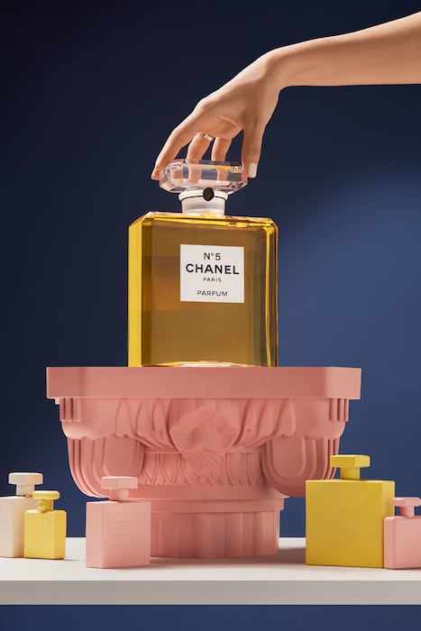 Photo of Chanel No. 5 perfume on pedestal, by London product photographer Aleksandra Kingo. 