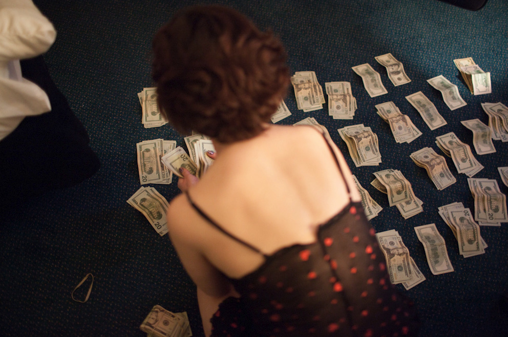 Alicia Vera shot of Eden counting money