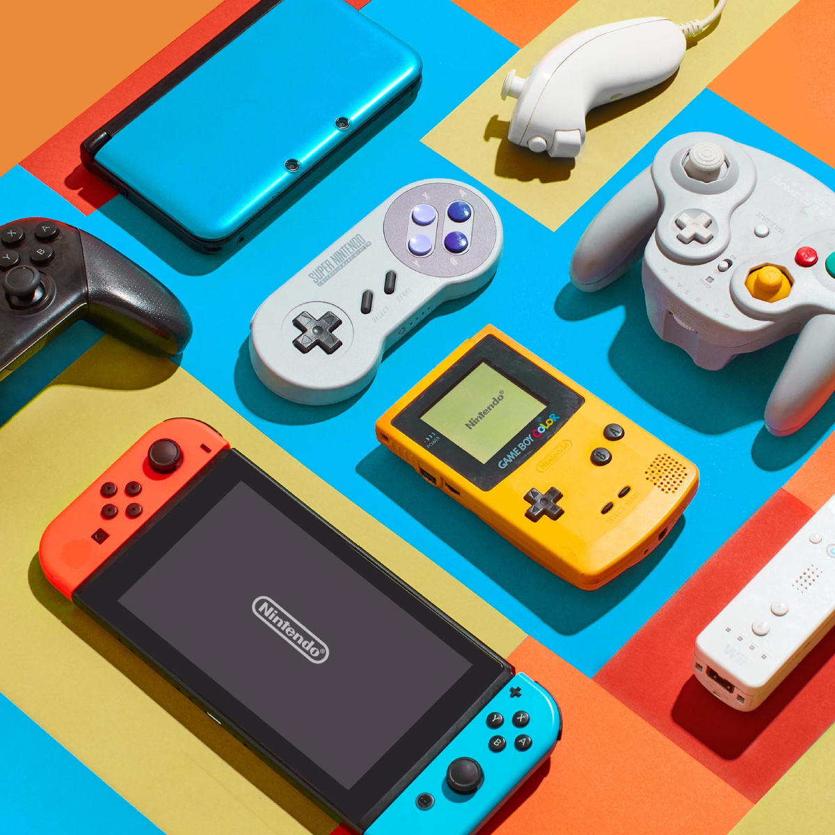 A color photo by Brandon Hill of a colorful still life arrangement of Nintendo products.