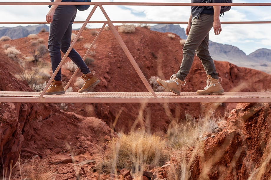 Hikers walking along a bridge at The Valley of Fire State Park. 