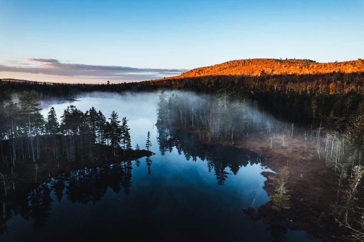 An aerial landscape photo by Chris Bennett showing the lake.