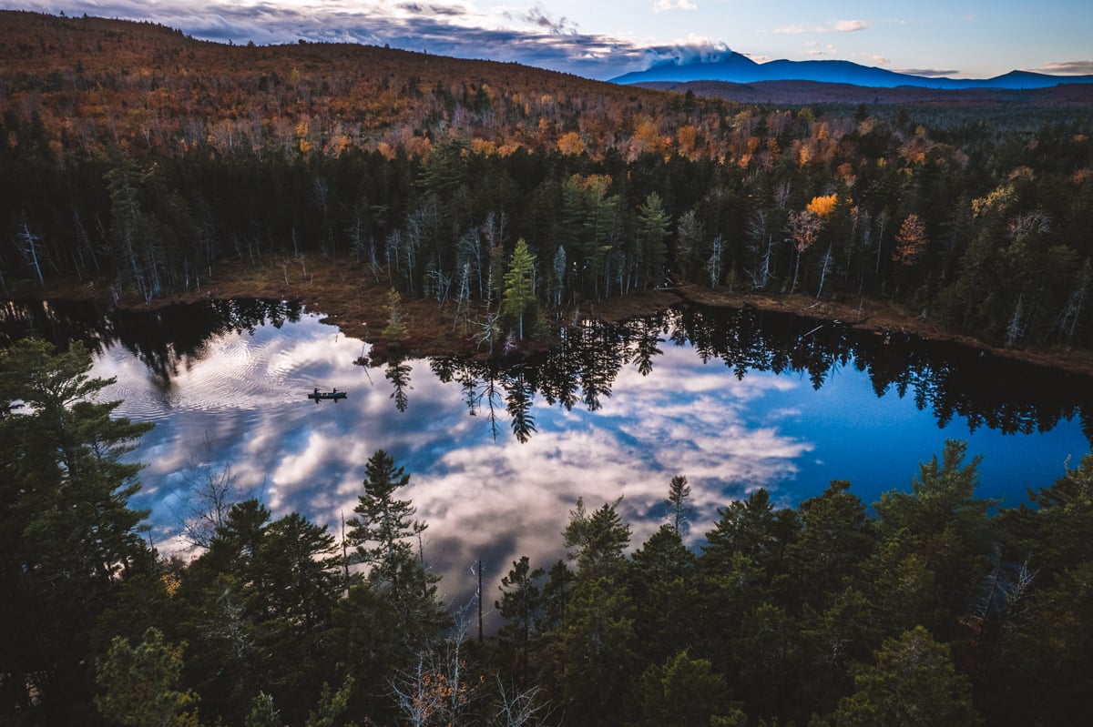 A aerial landscape photo by Chris Bennett of the lake in the forest.