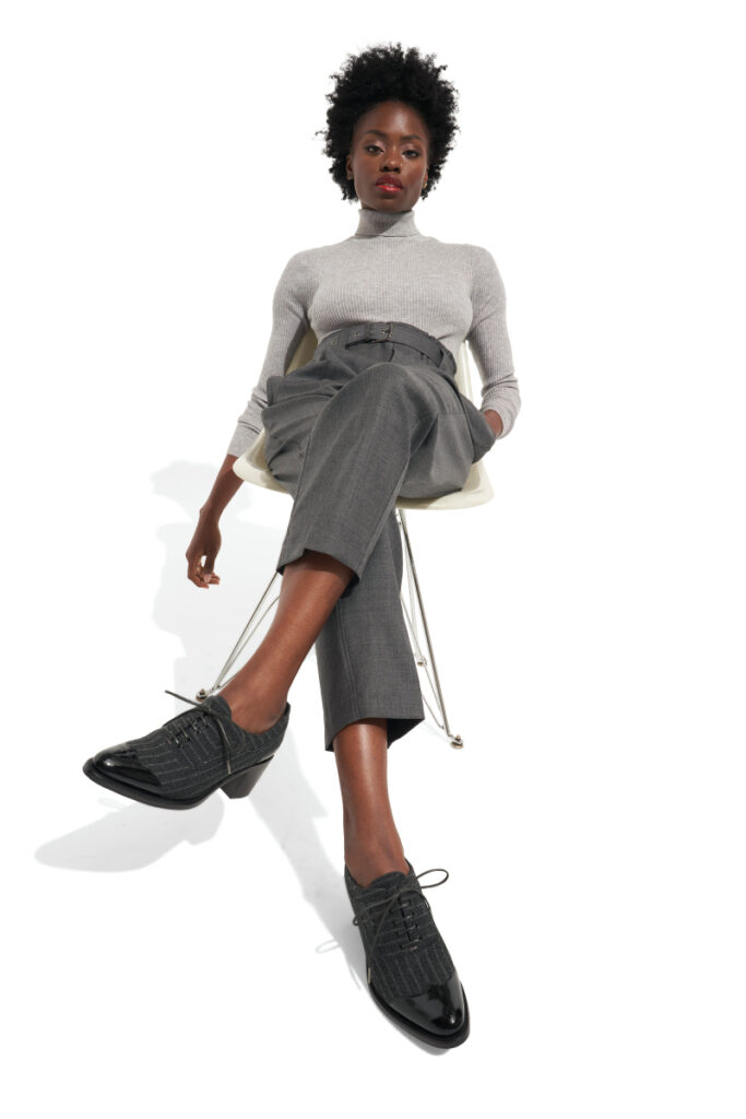 A model wearing The Office of Angela Scott shoes.
