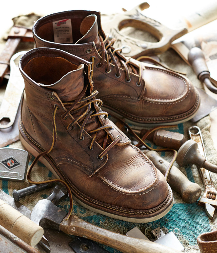 A color photograph by Darren Hendrix of a pair of brown work boots. 