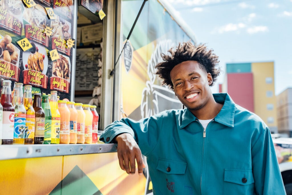 A photo of Colin Sexton at Jamaica's Kitchen food truck by Inti St. Clair. 