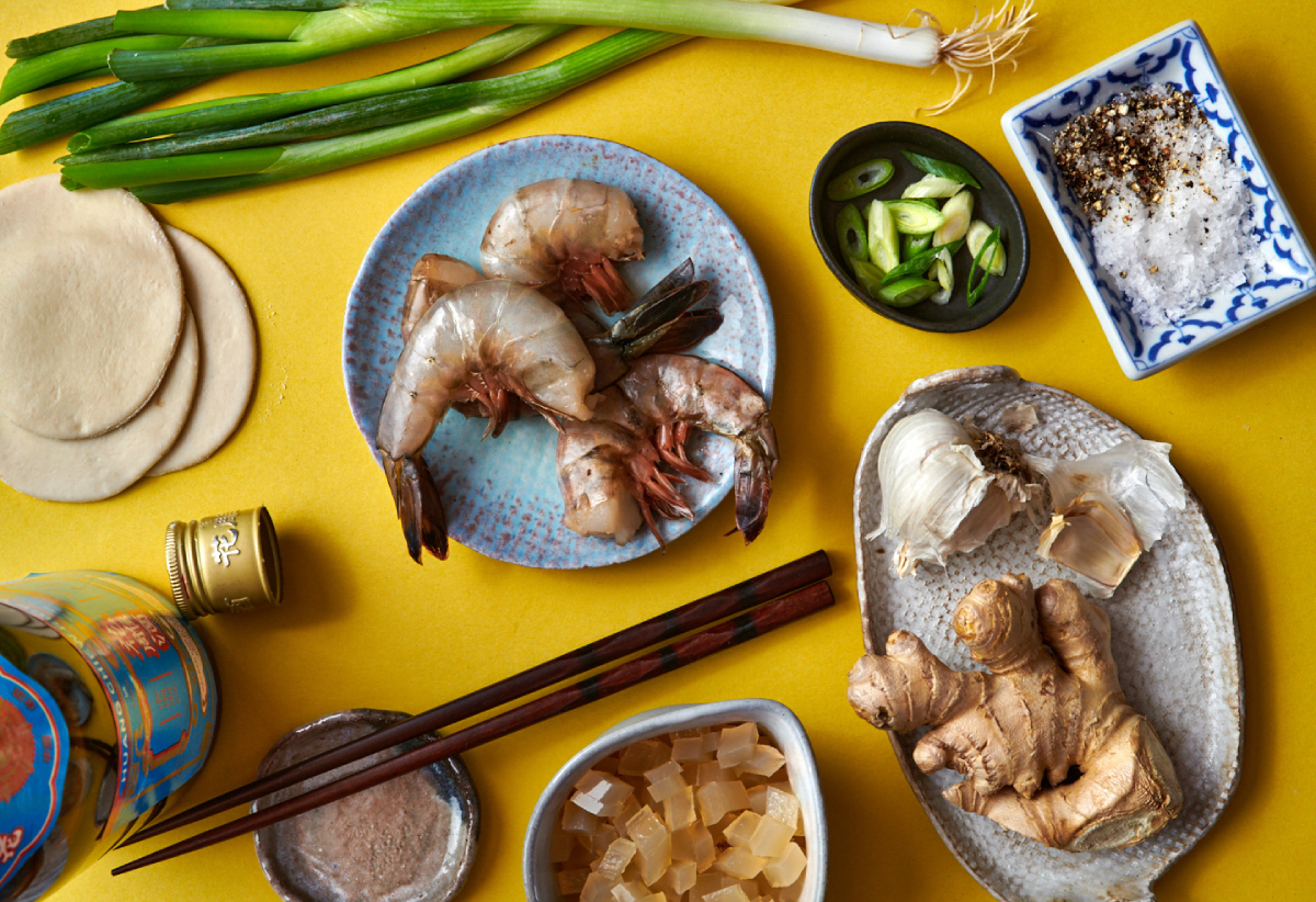 A color photo by Dina Ávila of the raw ingredients shot from above on a yellow table top.