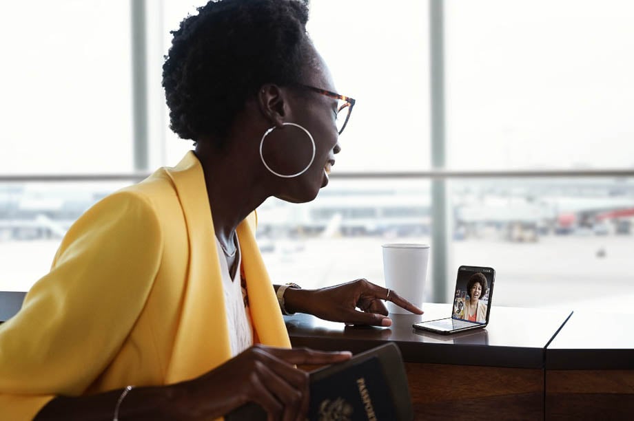 Photo of a businesswoman having a video call at an airport taken by Los Angeles-based lifestyle photographer Erik Isakson.